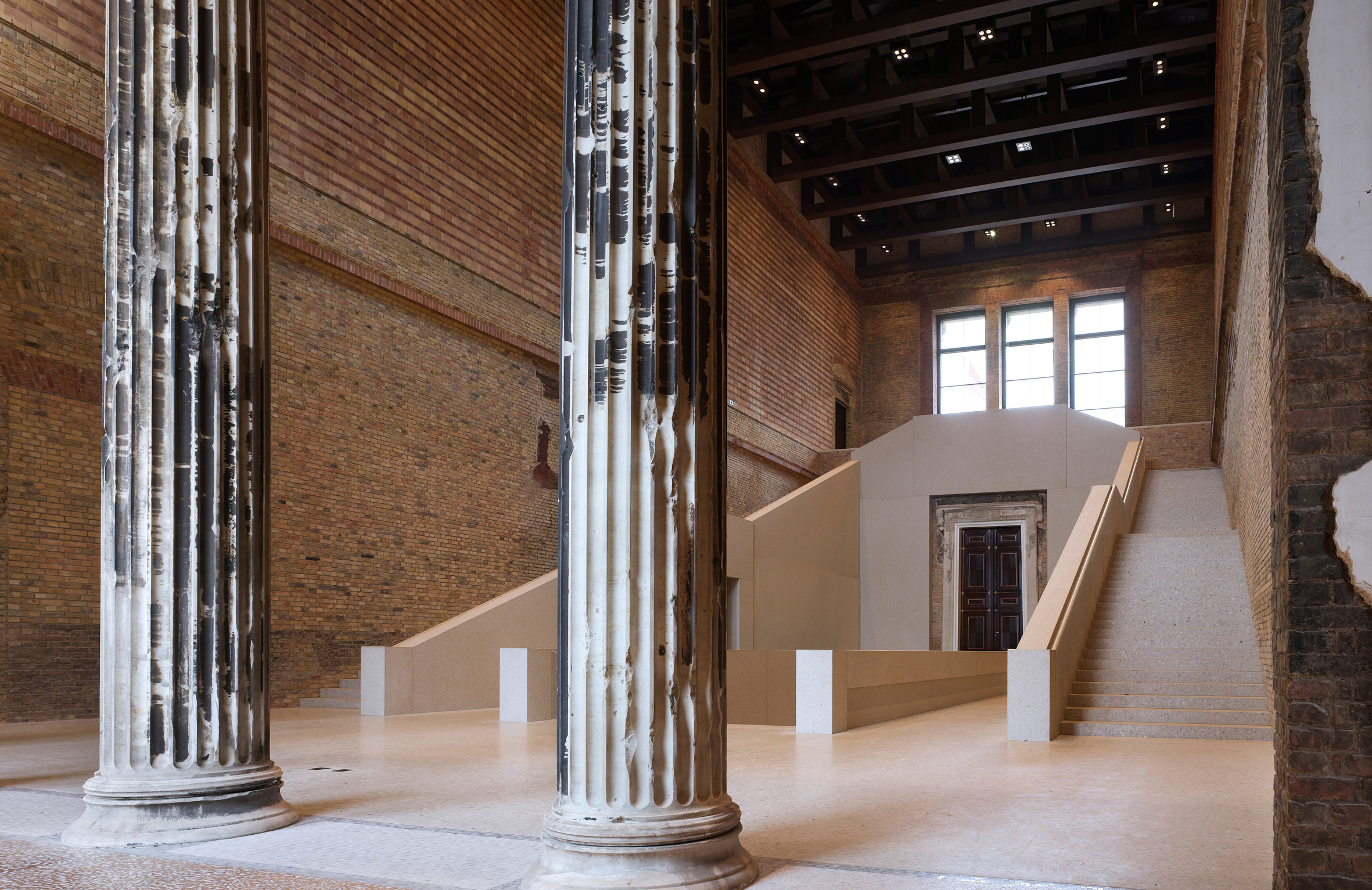 The bold new stair in the restored staircase hall follows the form but not the detail of Stüler’s original