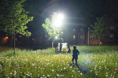 Powered by mobile generators, floodlights have been installed in New York City’s public housing project since 2014. Mayor Bill de Blasio explained that they will ‘light up the areas that have previously been obscure and problematic, and make it easier for the NYPD to do its job’. This still is from Nadia Hallgren’s 2021 film Omnipresence